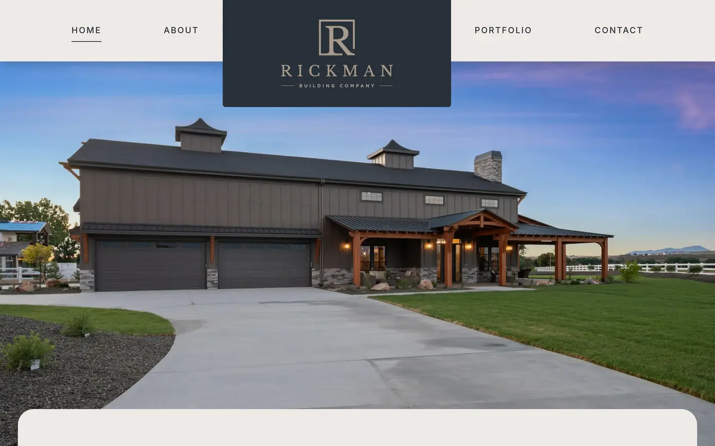 Rickman Building Company website homepage. Centered serif RICKMAN logo over a blue-hour photo of a custom Treasure Valley home.